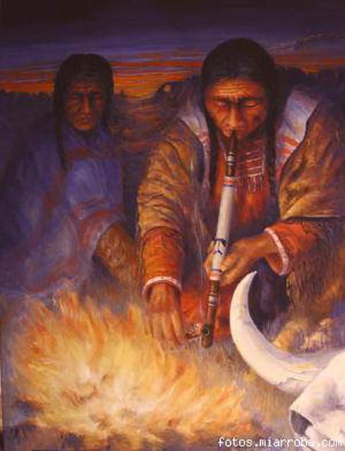 Indios fumando la pipa de la paz